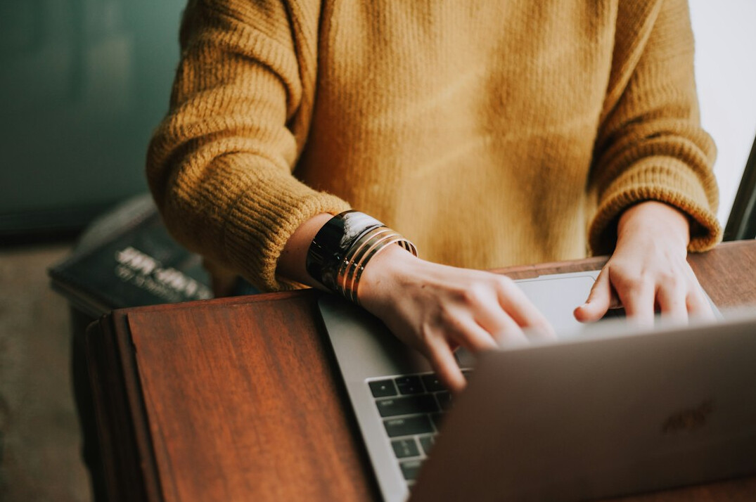 person working remotely on laptop