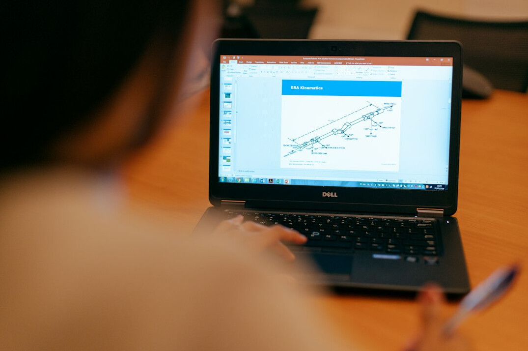 woman coding on laptop
