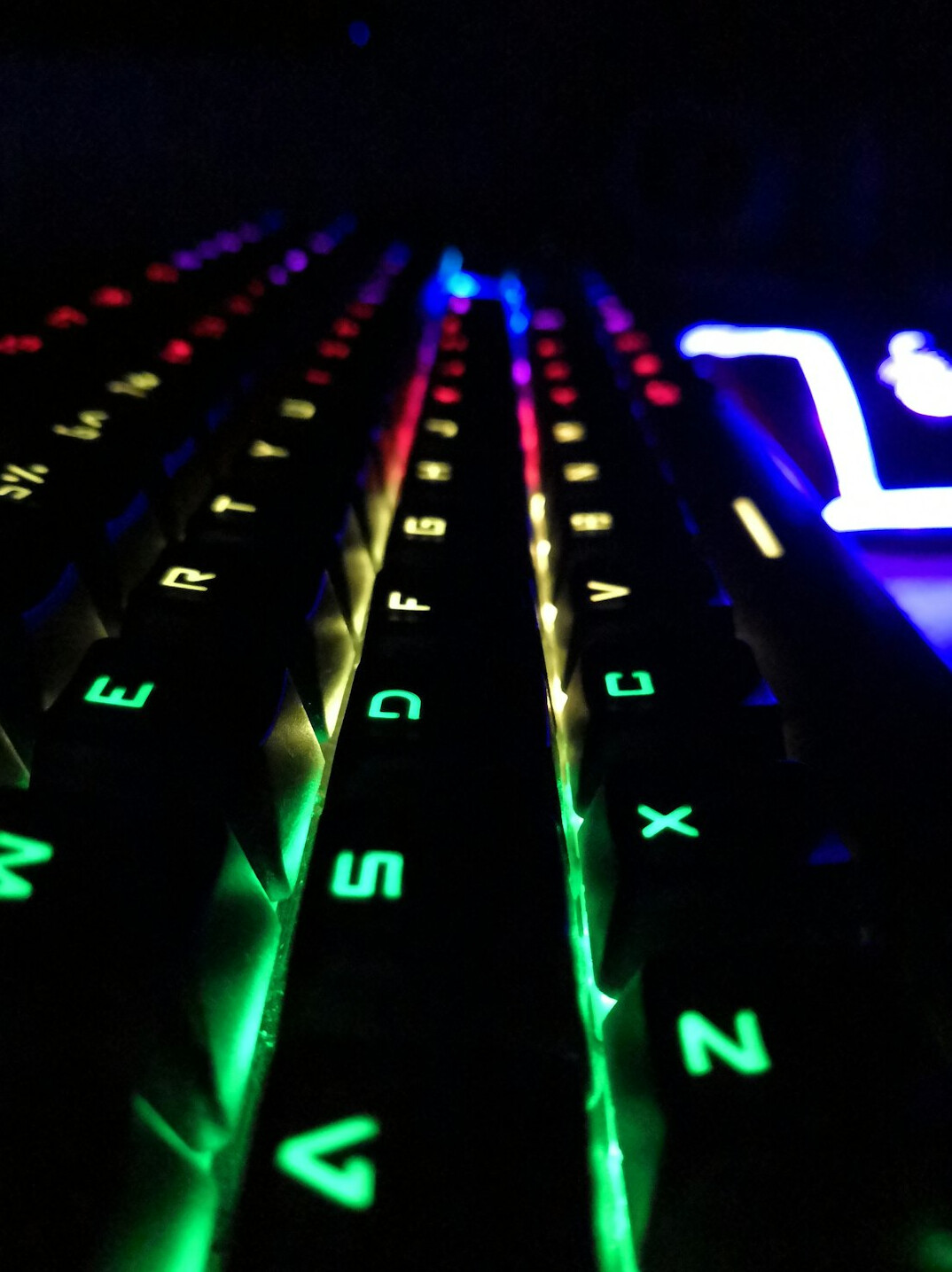 Close-up of a mechanical keyboard with colorful backlighting